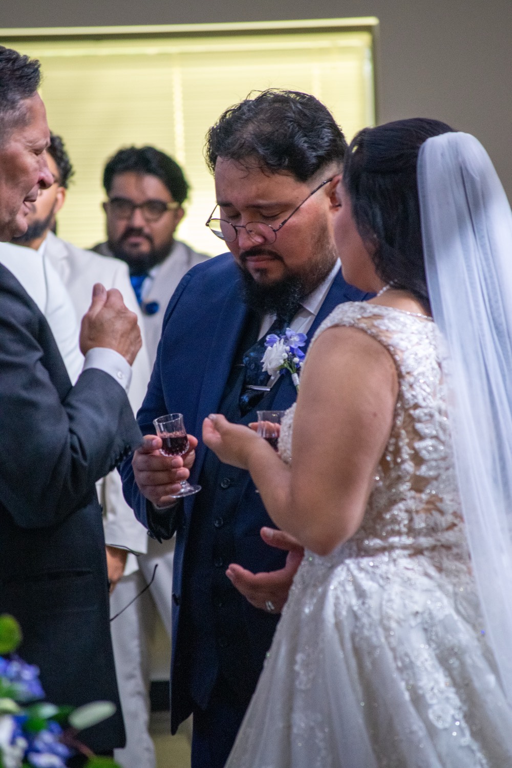 Bride in her veil among guests