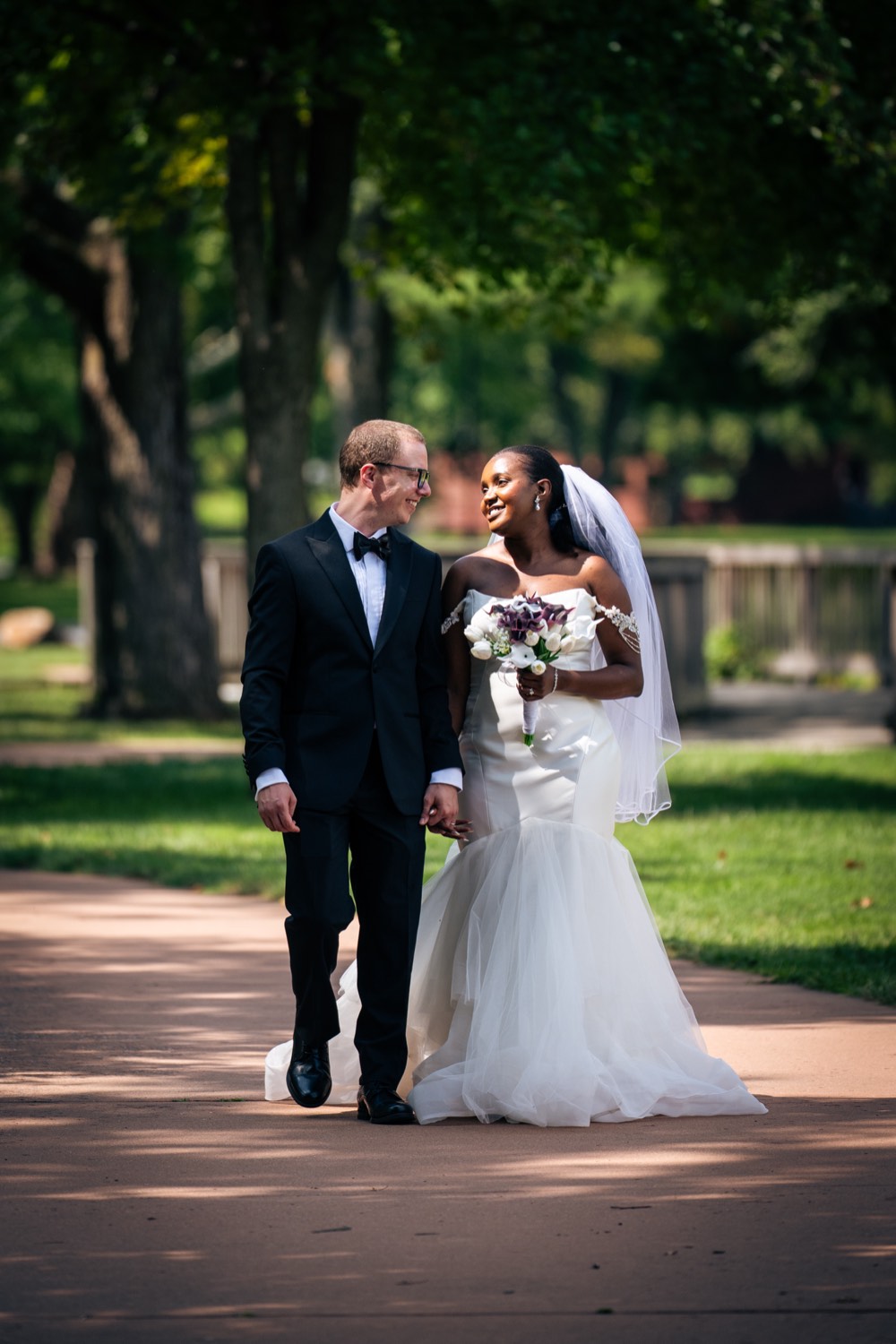 Couple walking together with the bouquet