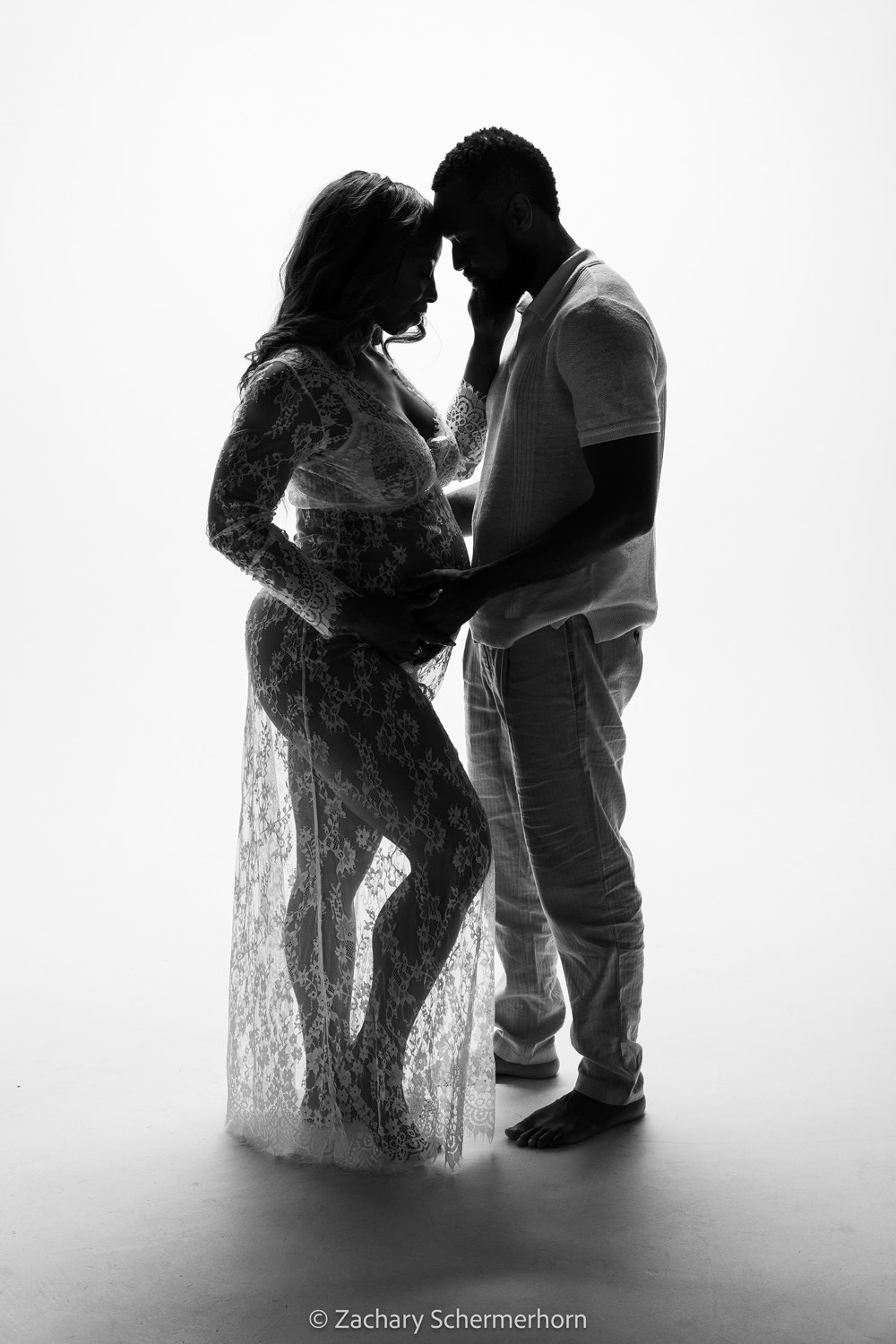 Black and white portrait of expecting parents