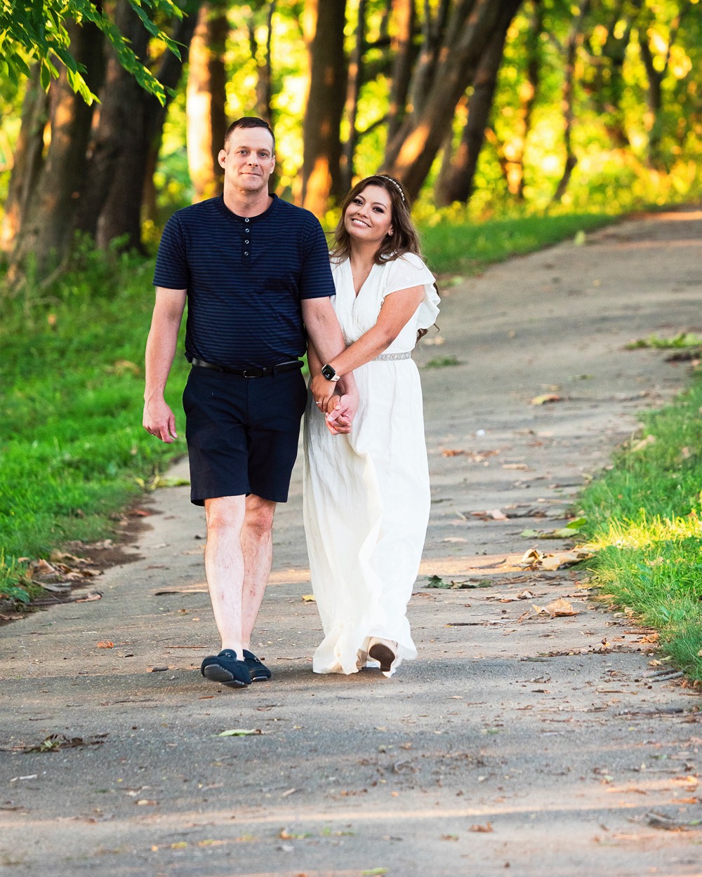 Couple walking a wooded path