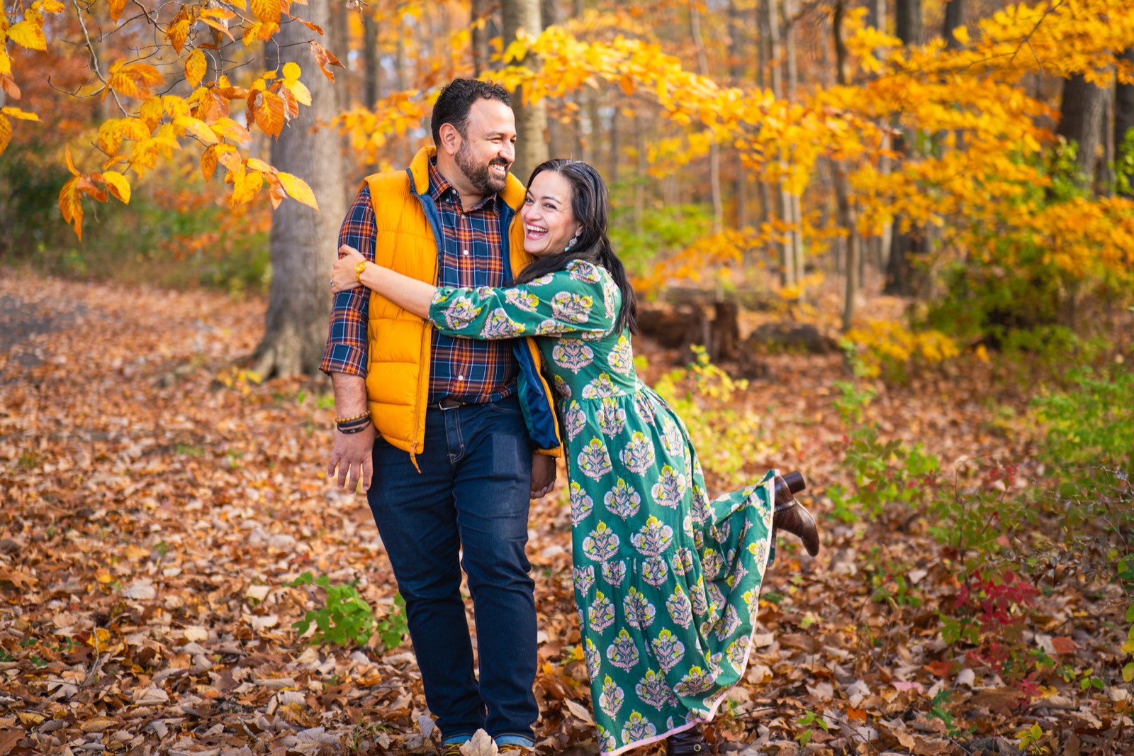 Couple among autumn leaves